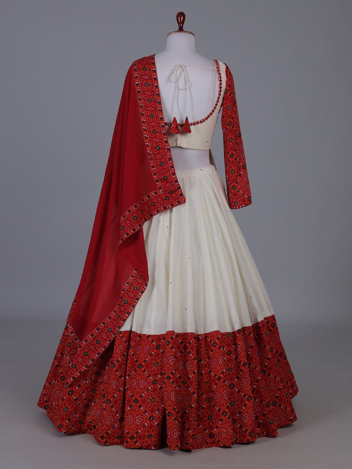 Red bandhani heritage lehenga with festive flair