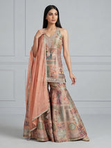 Pastel peach silk sharara suit with rich embellishment
