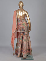 Pastel peach silk sharara suit with rich embellishment