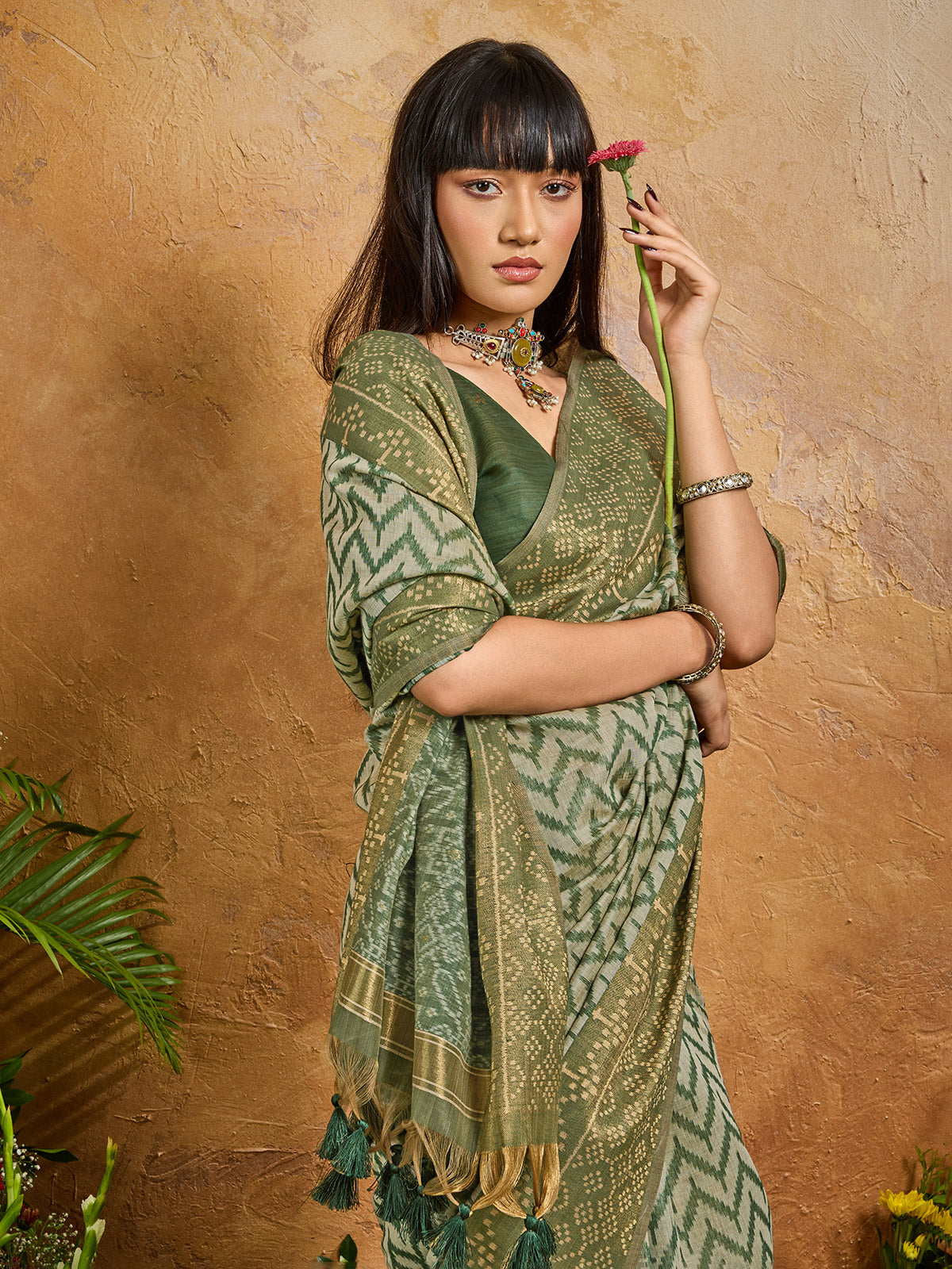 Green vibrant printed zari festive saree elegance