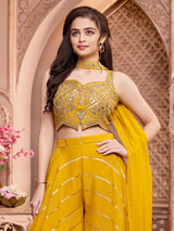 Yellow silk palazzo suit with rich embellish choli
