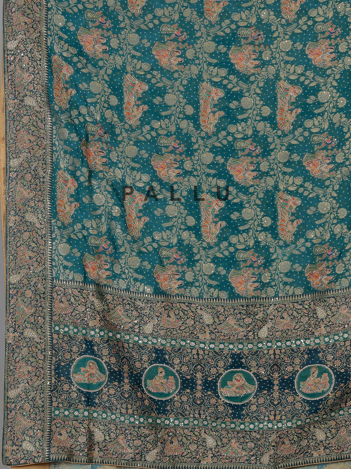 Teal green dola silk saree with royal motifs
