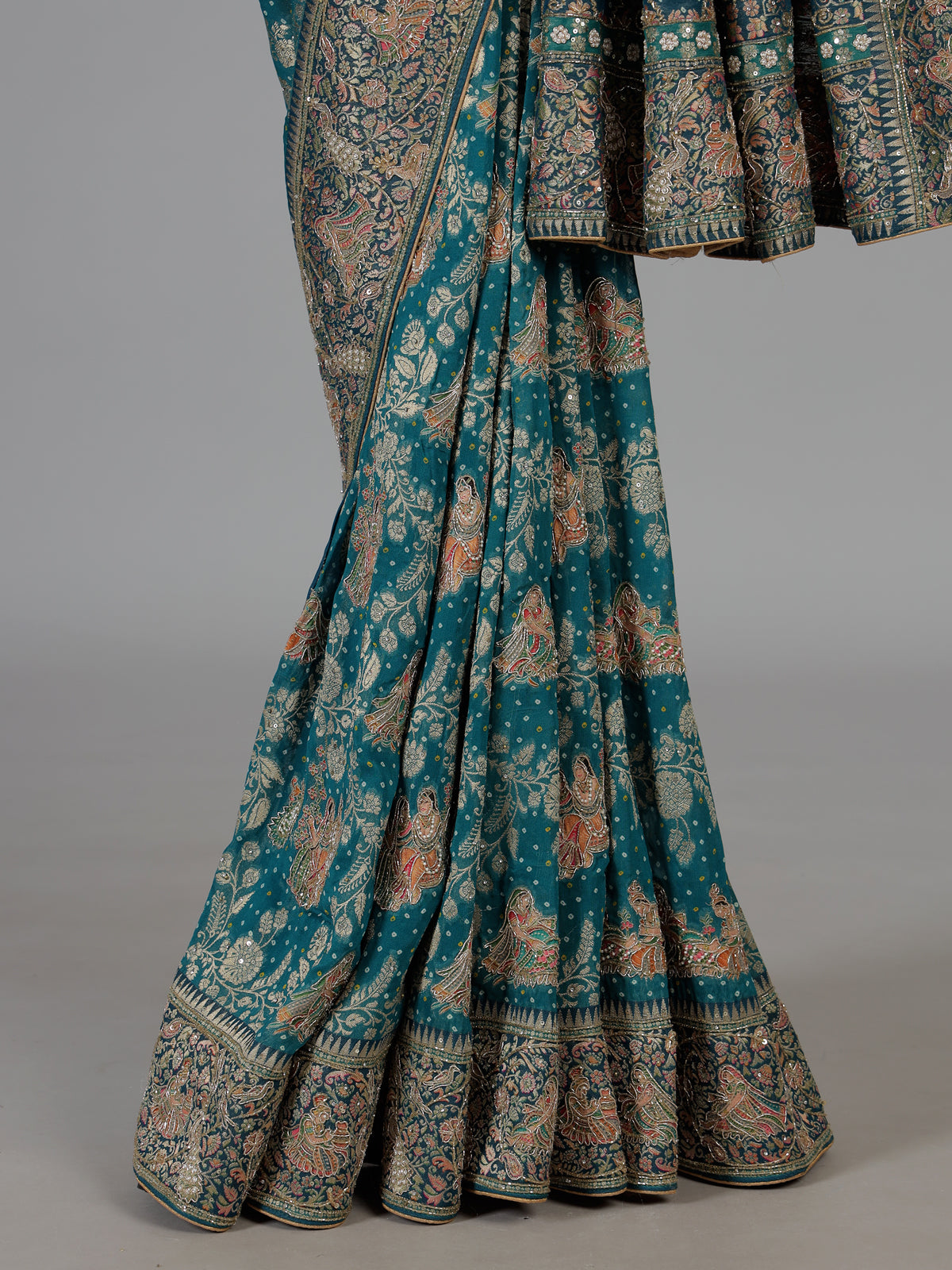 Teal green dola silk saree with royal motifs