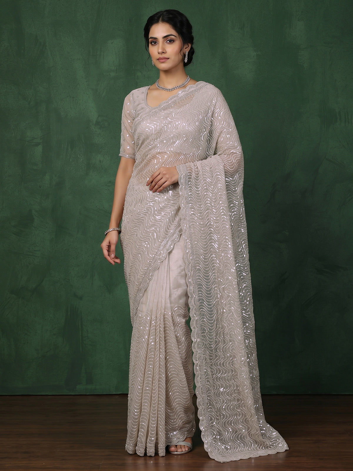 Beige tissue silk wedding wear saree with sequins and cutdana work