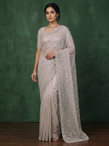 Beige tissue silk wedding wear saree with sequins and cutdana work