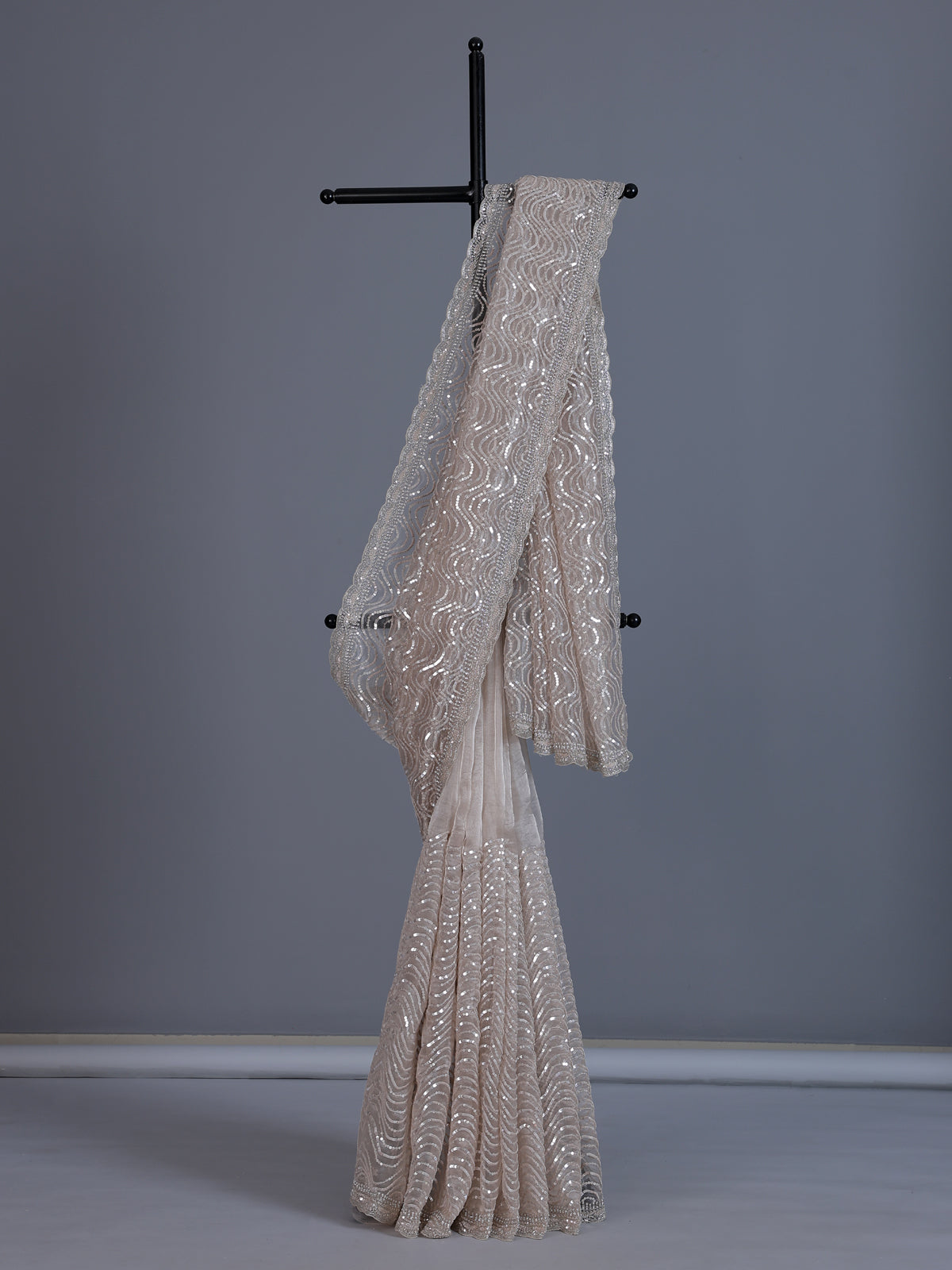 Beige tissue silk wedding wear saree with sequins and cutdana work