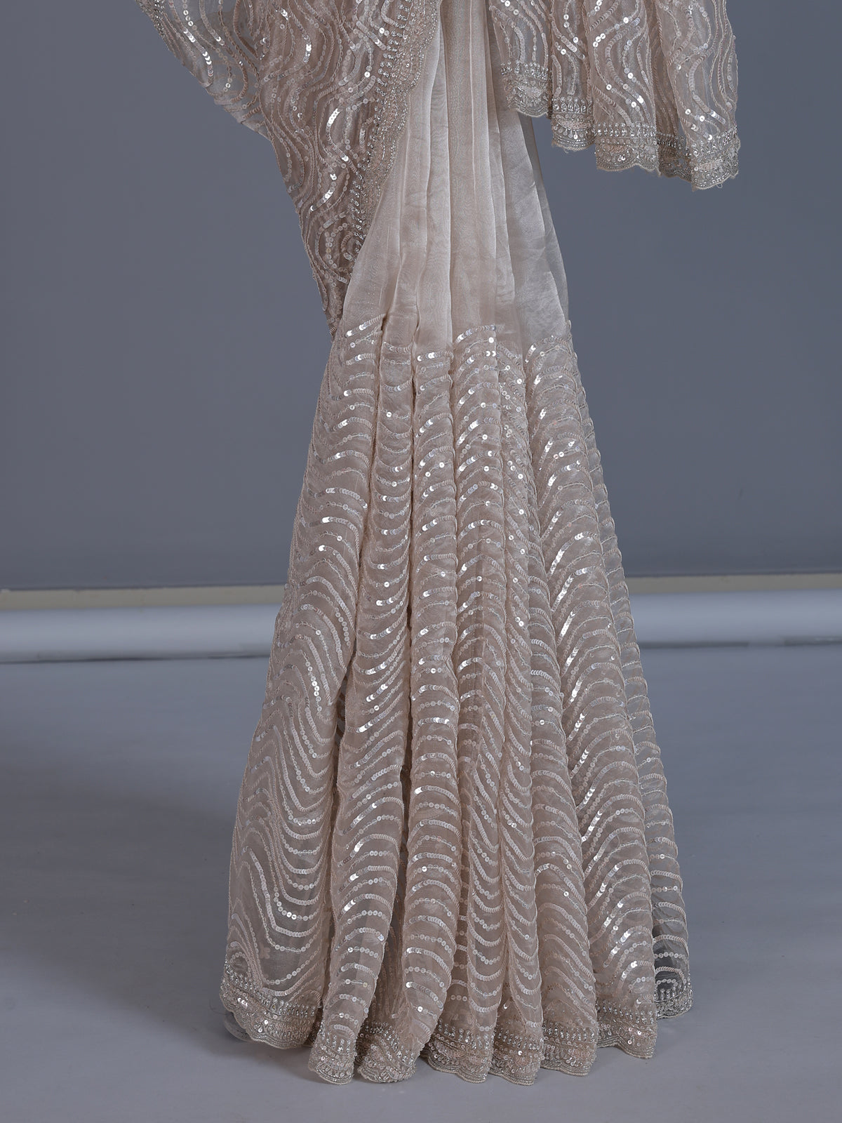 Beige tissue silk wedding wear saree with sequins and cutdana work
