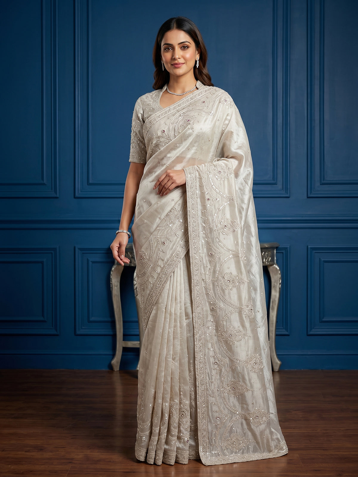 Beige tissue silk reception wear saree with cutdana work