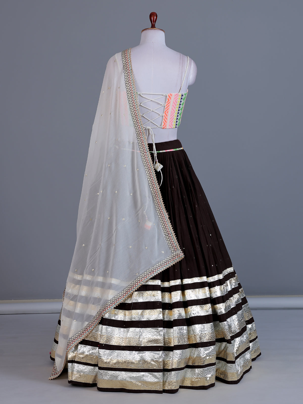 Brown navratri wear tissue silk lehenga choli with gota patti