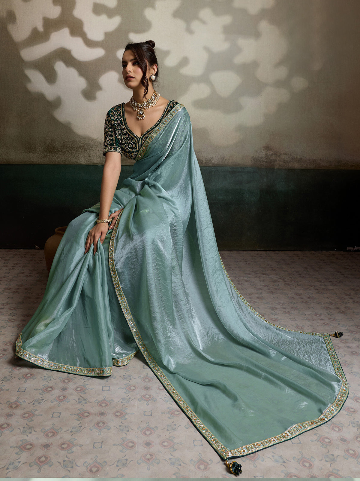 Sage green satin saree with cutdana worked blouse