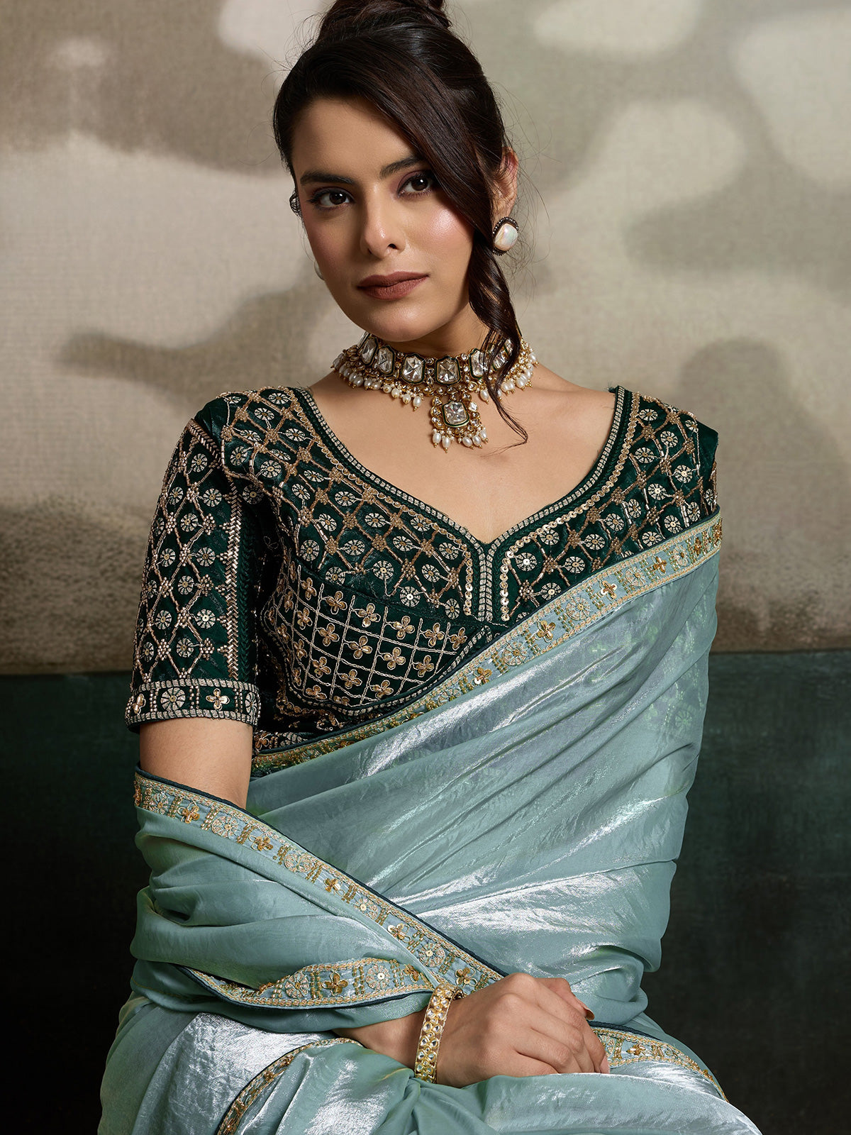 Sage green satin saree with cutdana worked blouse