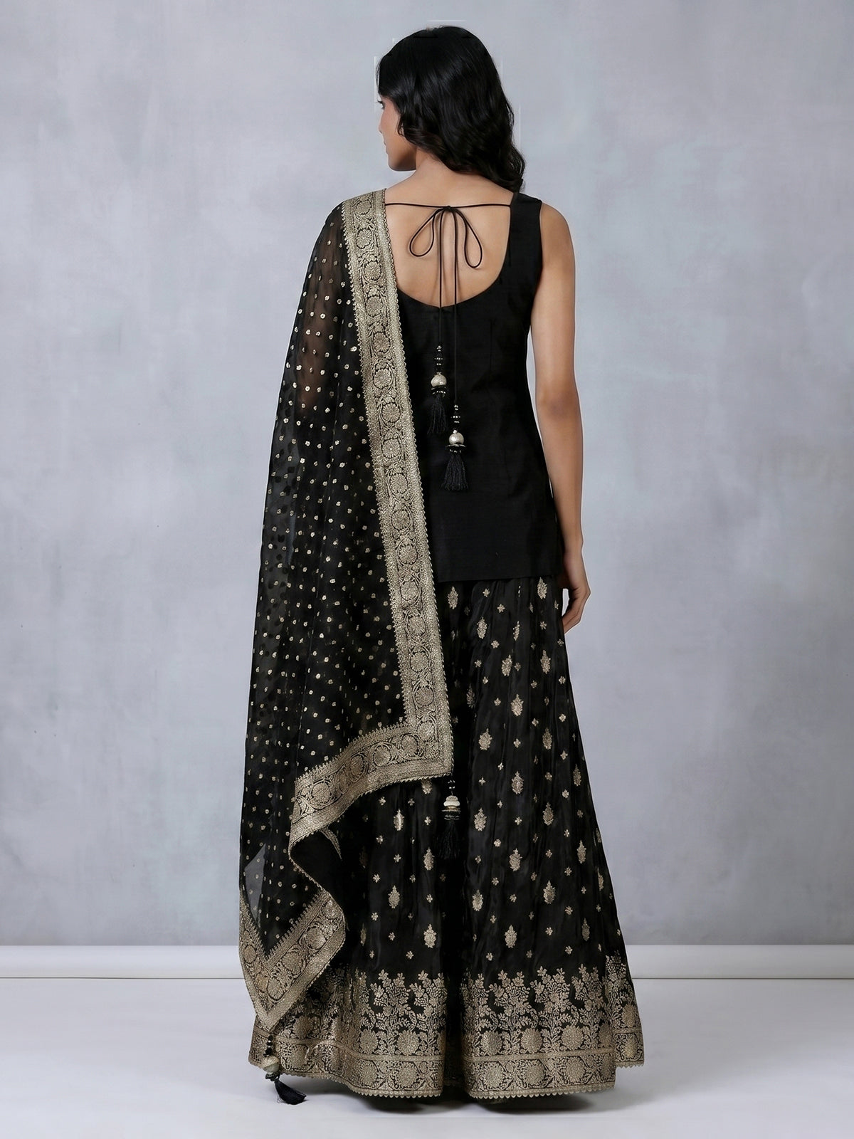 Black silk palazzo suit with elegant embellishments