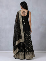 Black silk palazzo suit with elegant embellishments