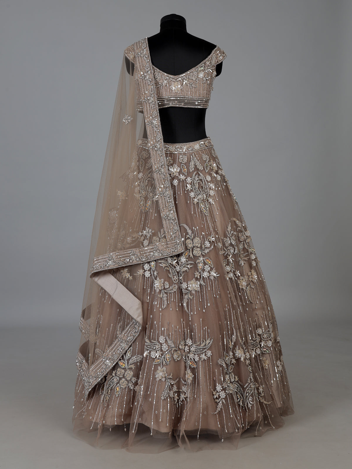 Beige net embellished lehenga choli for wedding functions