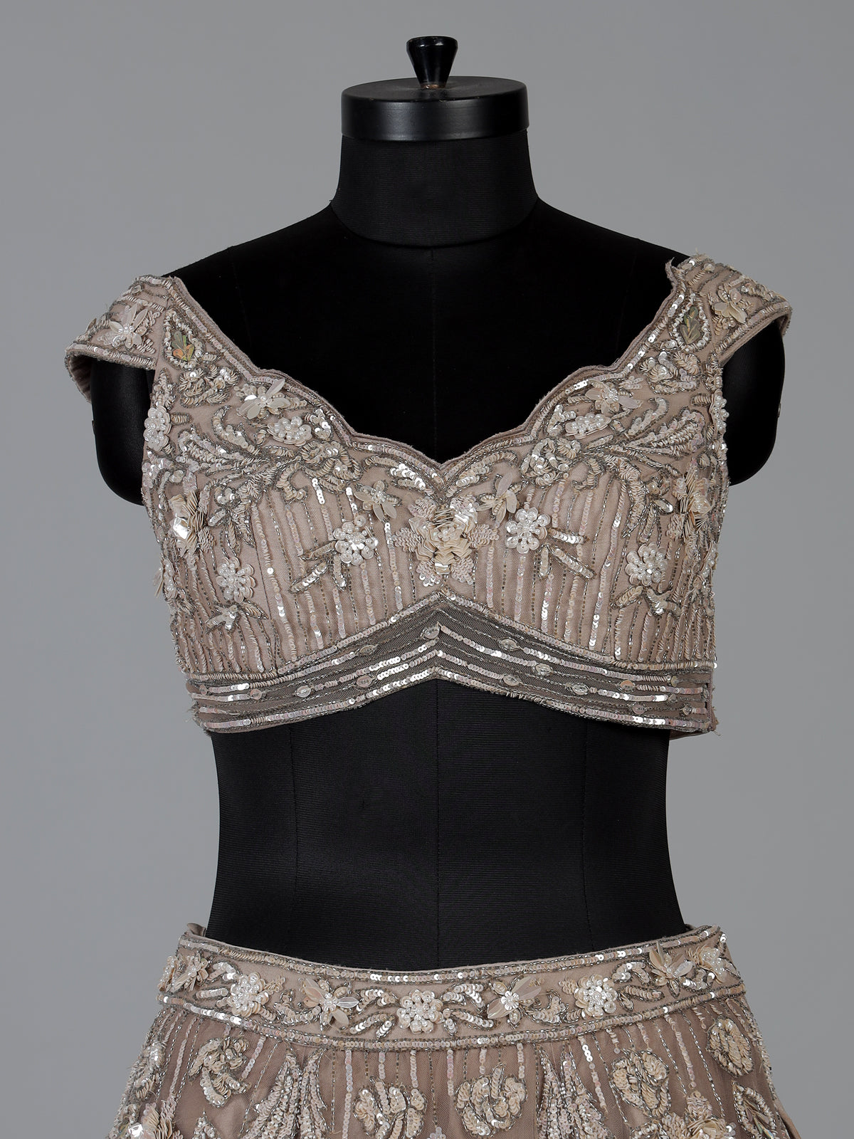 Beige net embellished lehenga choli for wedding functions