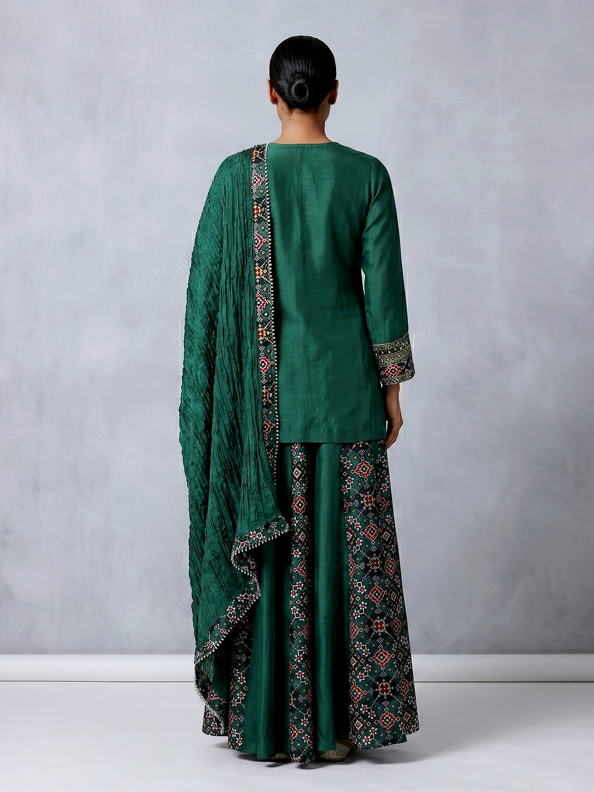 Dark green embroidered silk palazzo suit with printed dupatta