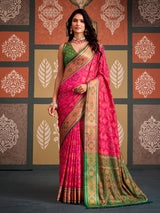 Vibrant pink bandhani inspired patola silk saree with contrast green blouse