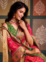 Vibrant pink bandhani inspired patola silk saree with contrast green blouse