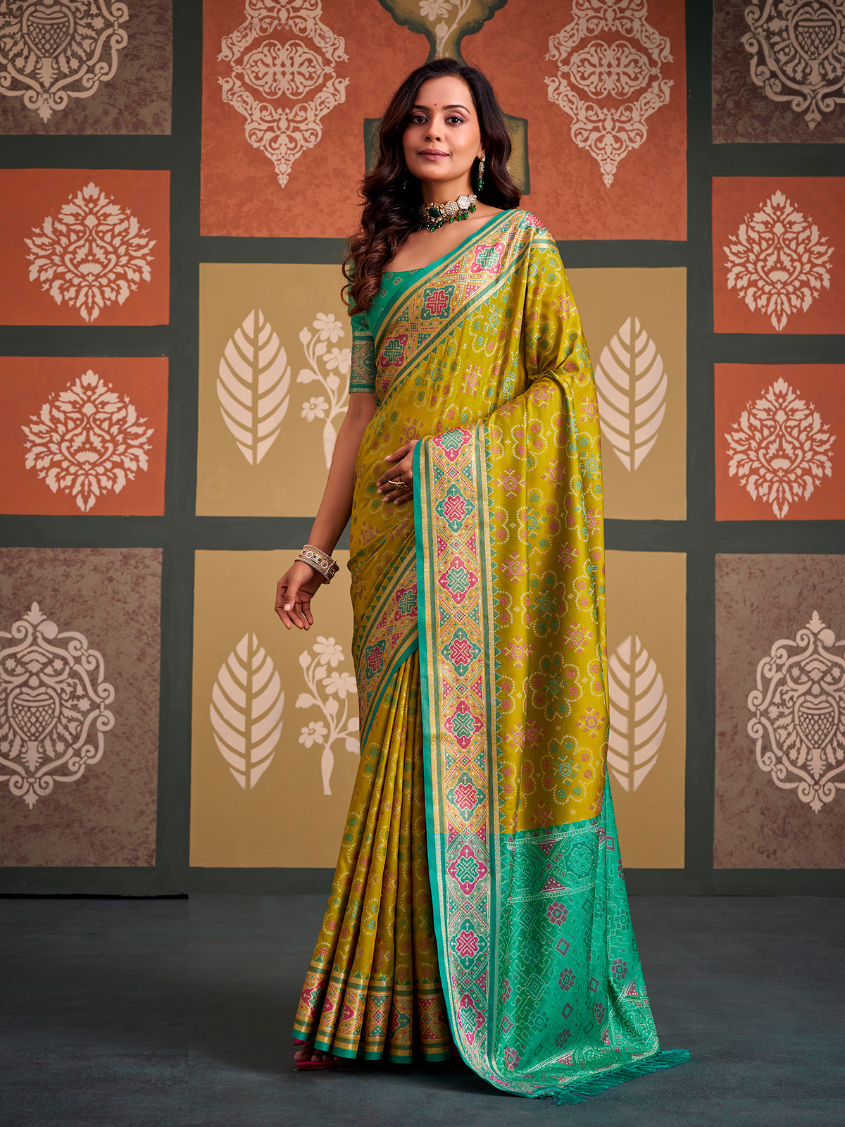 Majestic green bandhani patola silk saree with contrast sky blue blouse