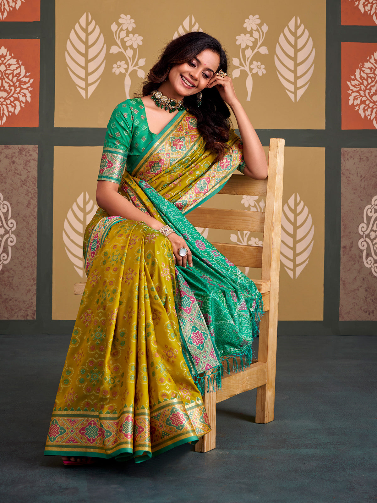 Majestic green bandhani patola silk saree with contrast sky blue blouse