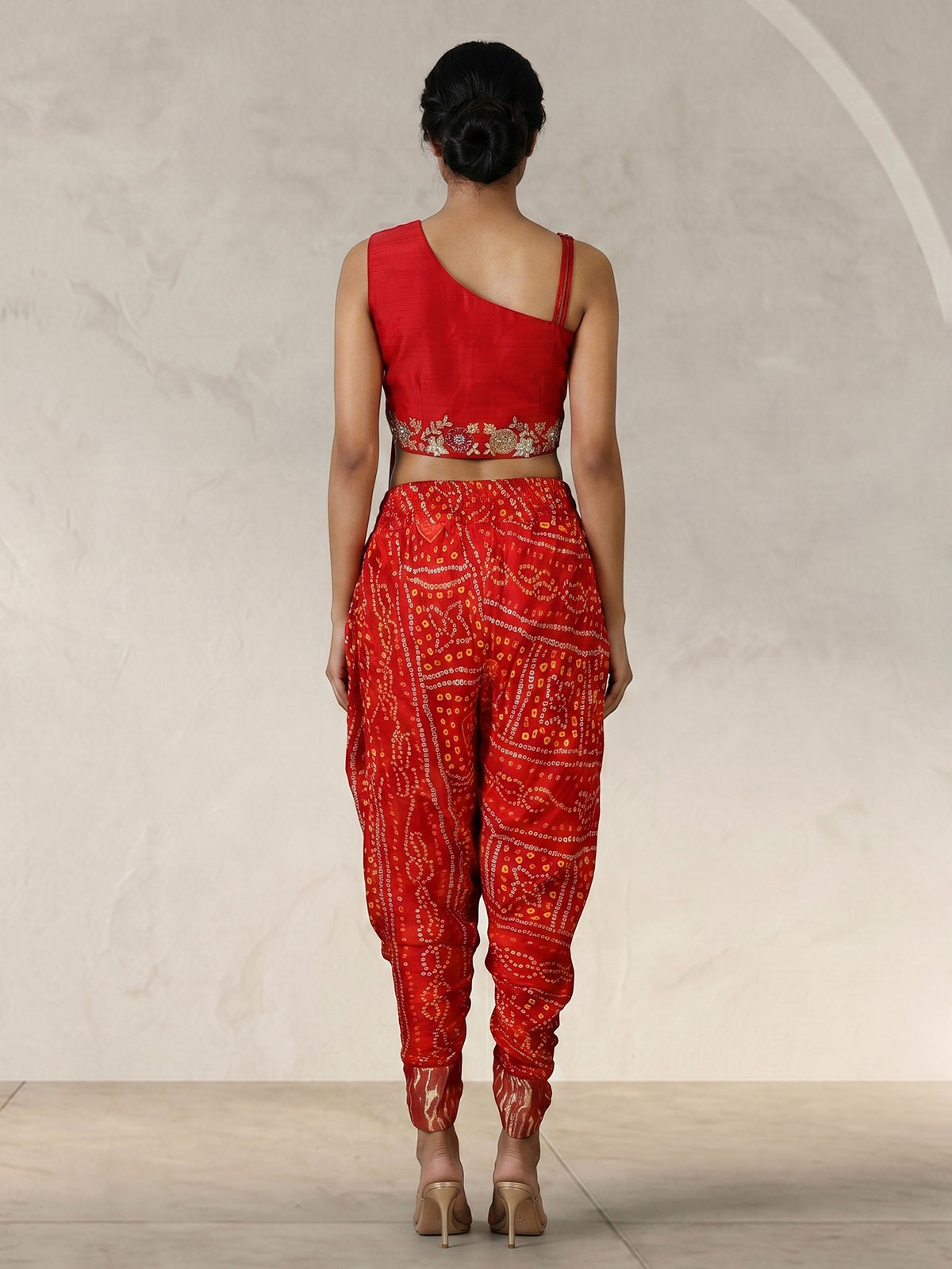 Red bandhej printed silk dhoti suit with embellishments