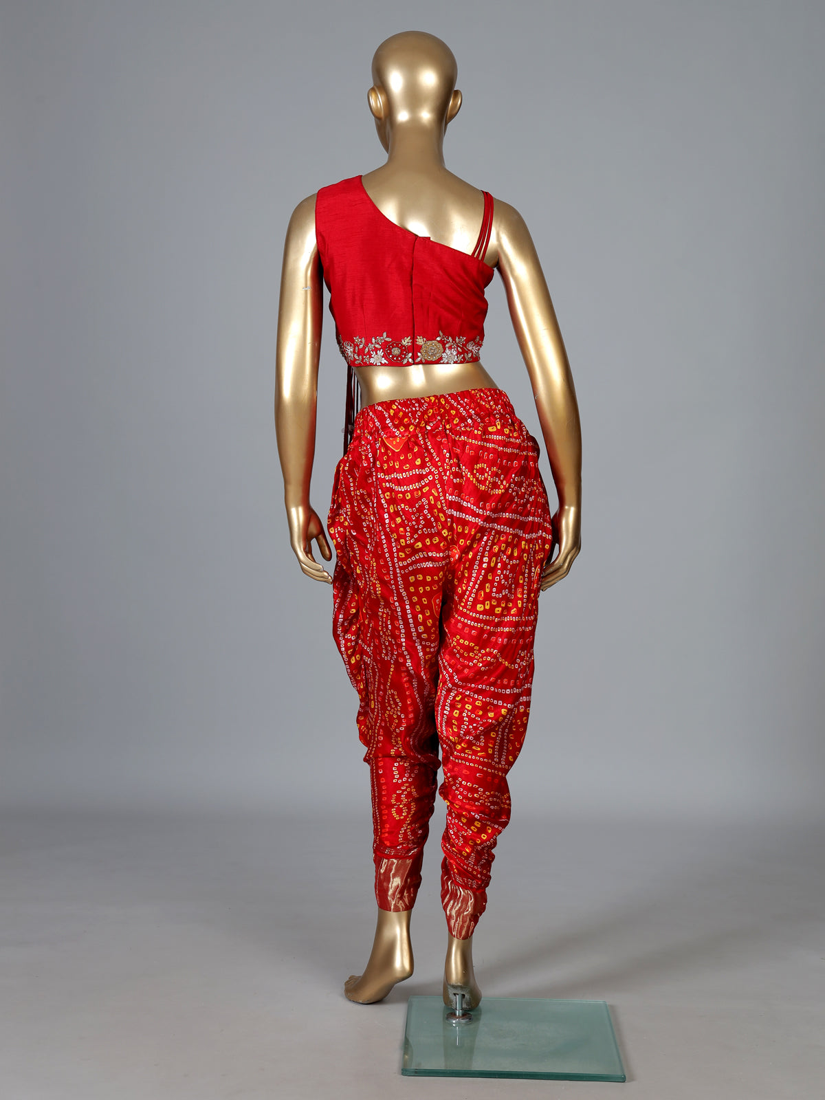 Red bandhej printed silk dhoti suit with embellishments
