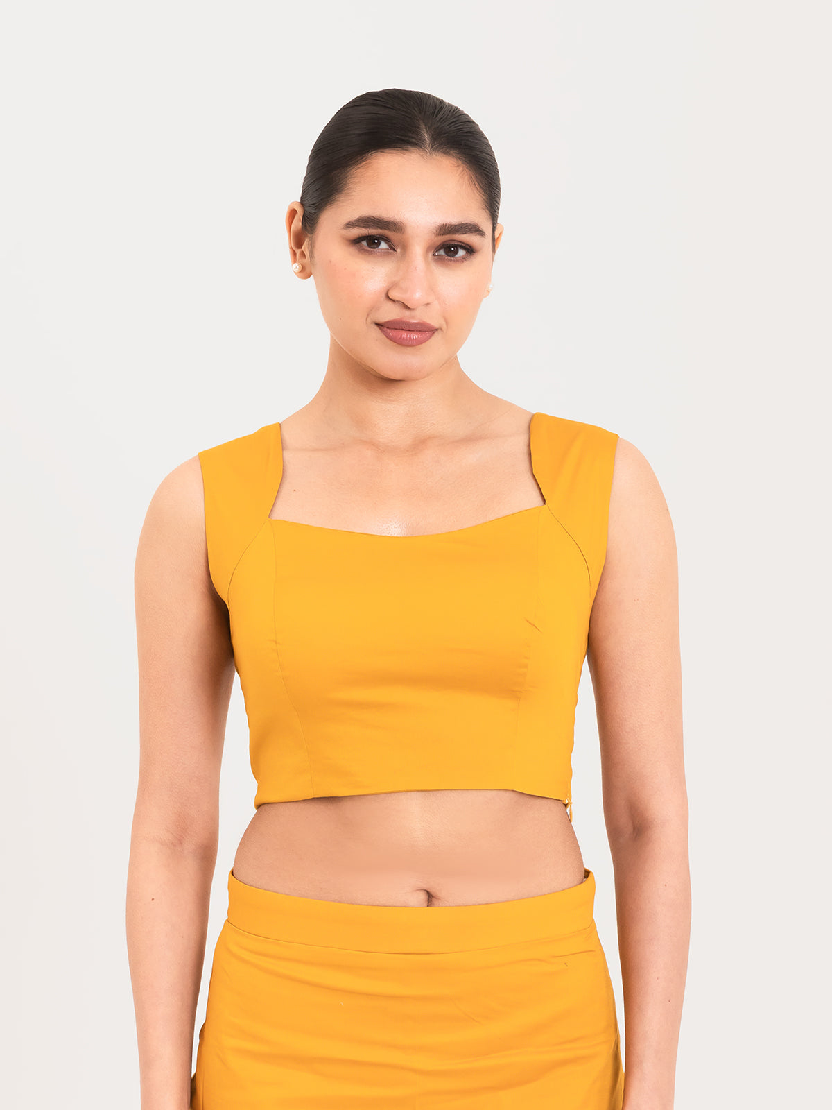 Yellow cotton lycra curved sweetheart neck sleeveless blouse