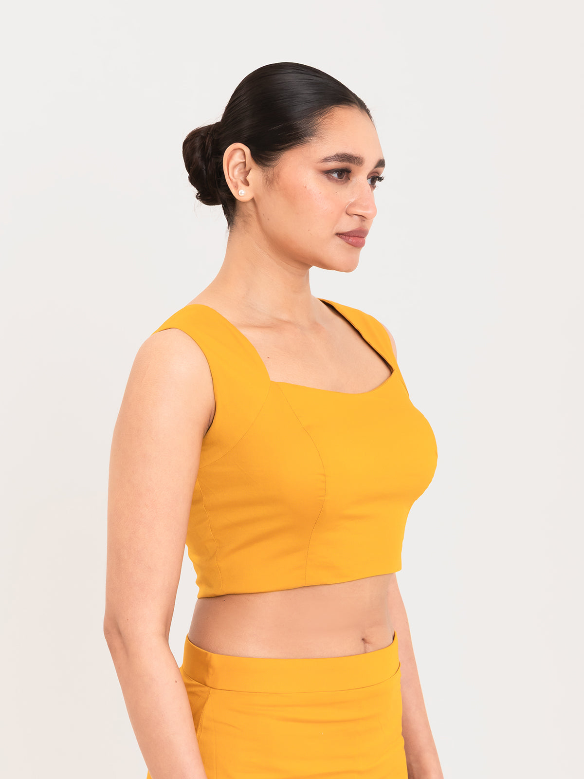 Yellow cotton lycra curved sweetheart neck sleeveless blouse