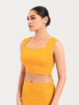 Yellow cotton lycra curved sweetheart neck sleeveless blouse