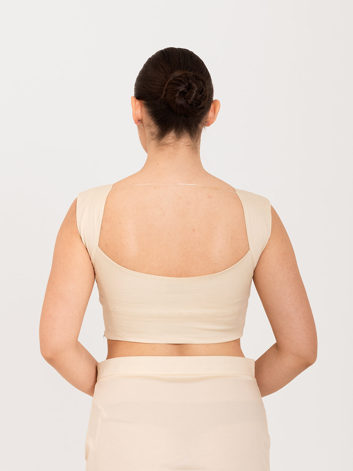 White cotton lycra curved sweetheart neck sleeveless blouse