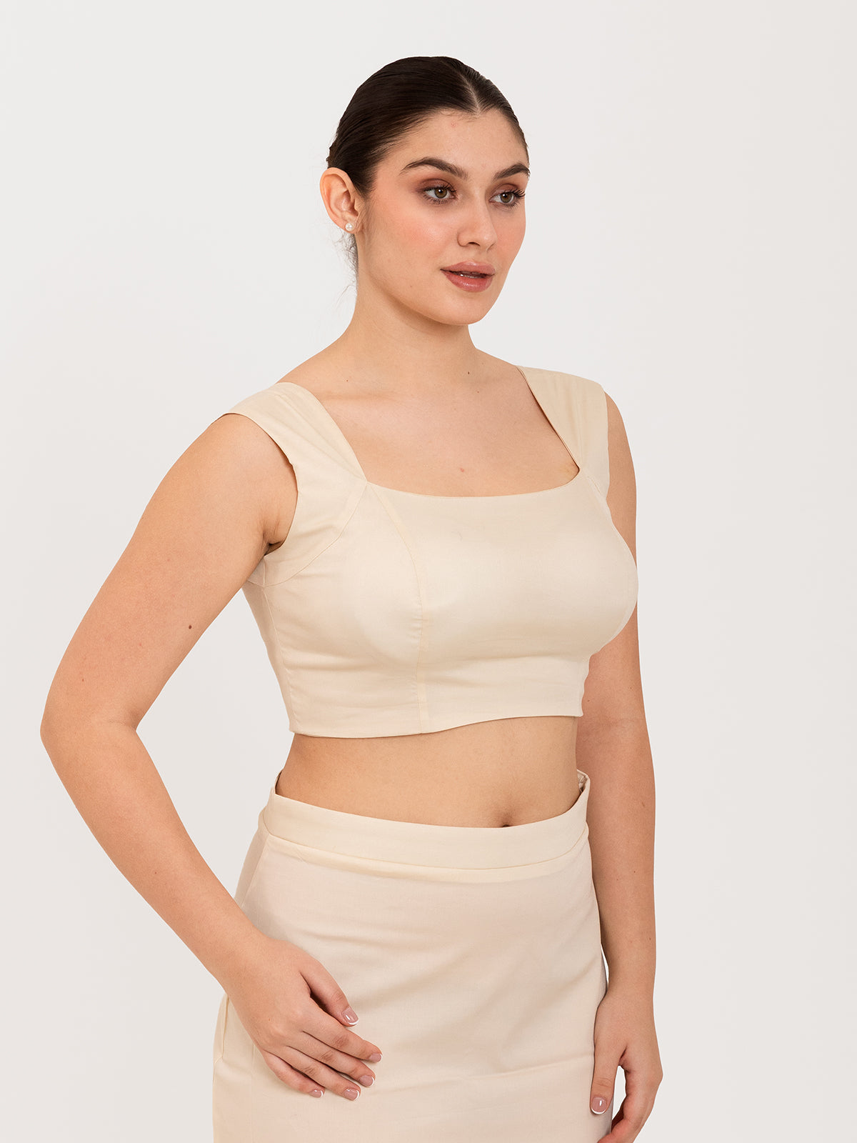 White cotton lycra curved sweetheart neck sleeveless blouse