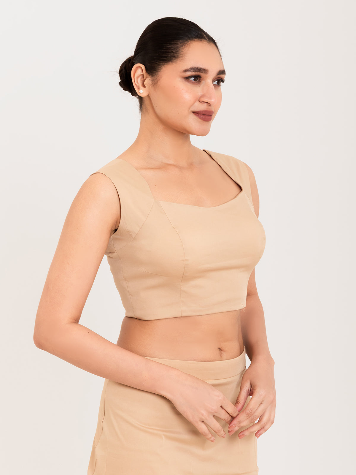 Beige cotton lycra curved sweetheart neck sleeveless blouse