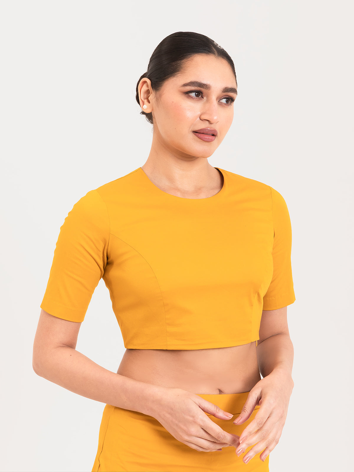 Yellow cotton lycra round neck sleeveless blouse