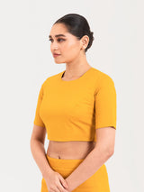 Yellow cotton lycra round neck sleeveless blouse