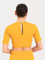 Yellow cotton lycra round neck sleeveless blouse