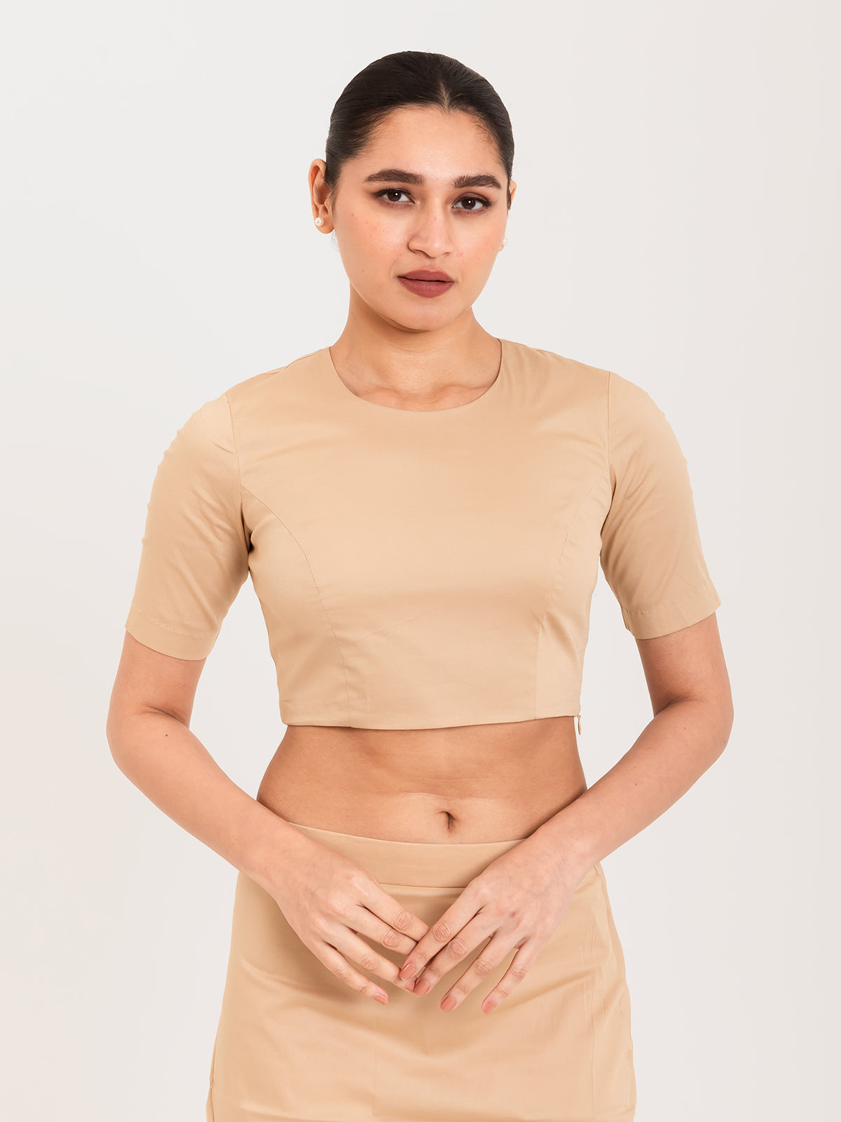 Beige cotton lycra round neck sleeveless blouse