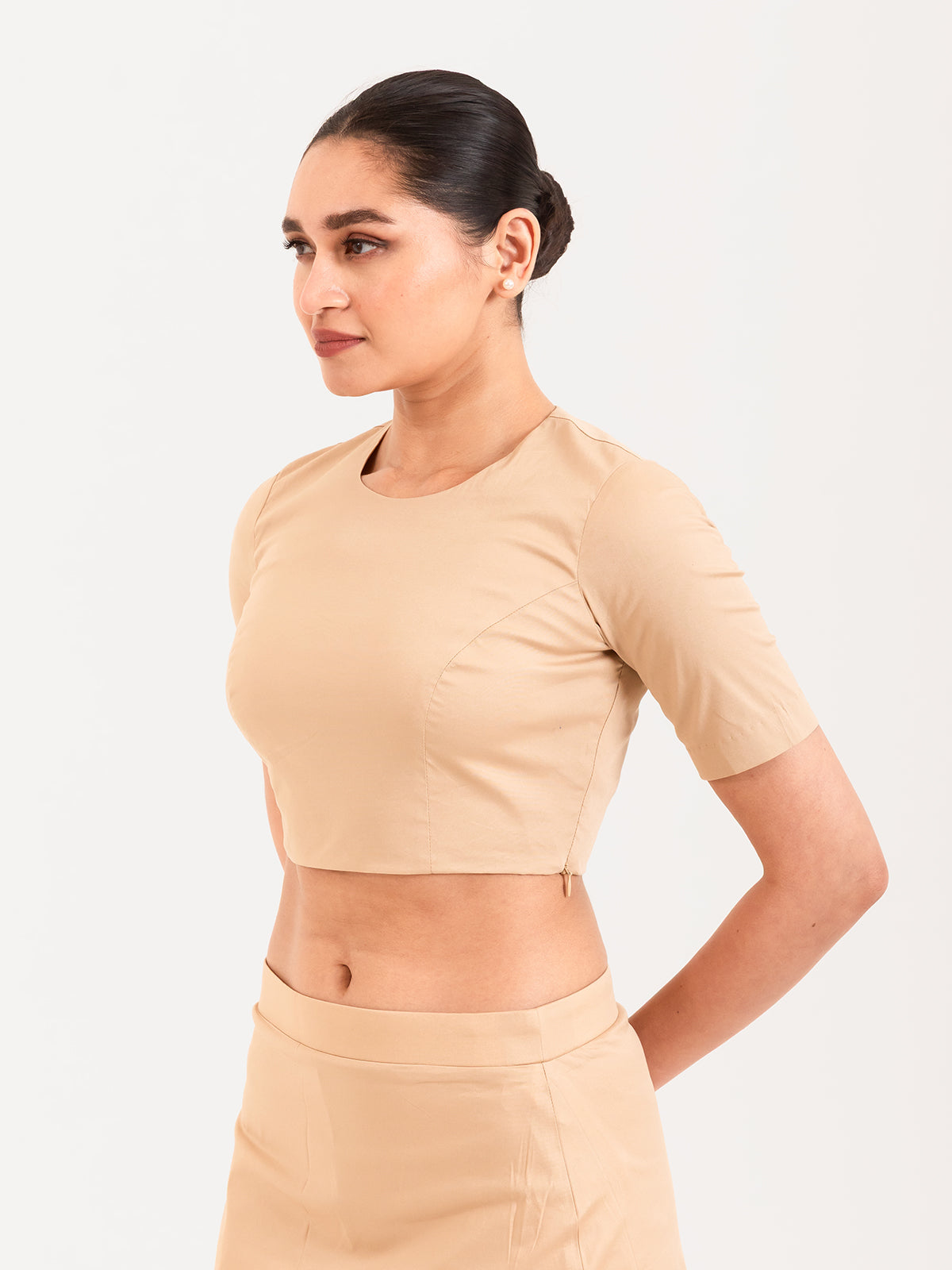 Beige cotton lycra round neck sleeveless blouse