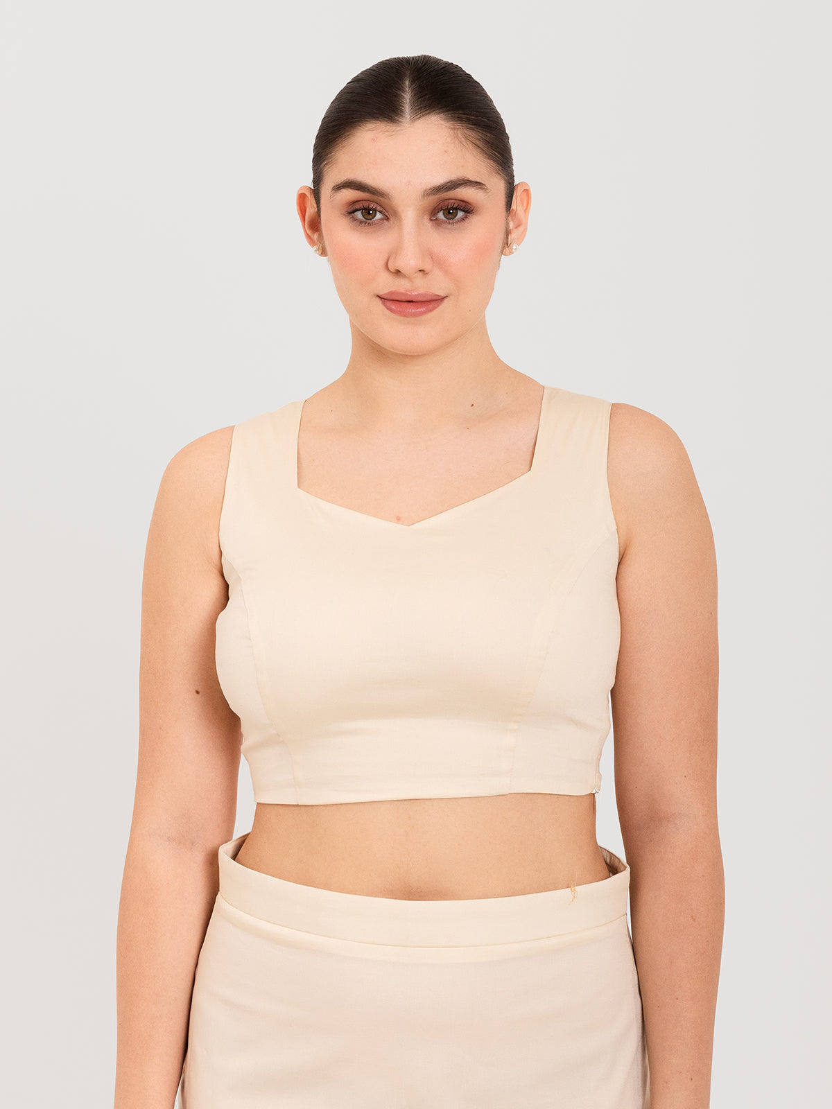 White cotton lycra sweetheart neck sleeveless blouse