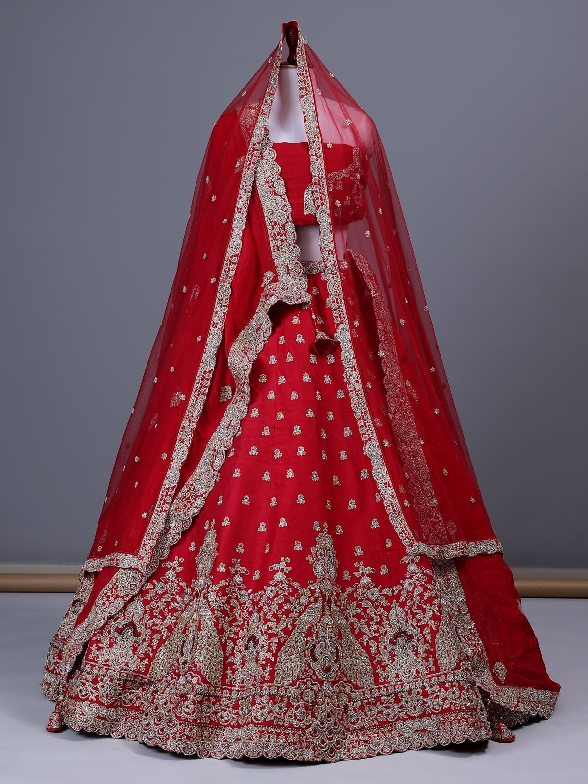 Red raw silk bridal lehenga choli with bird motifs