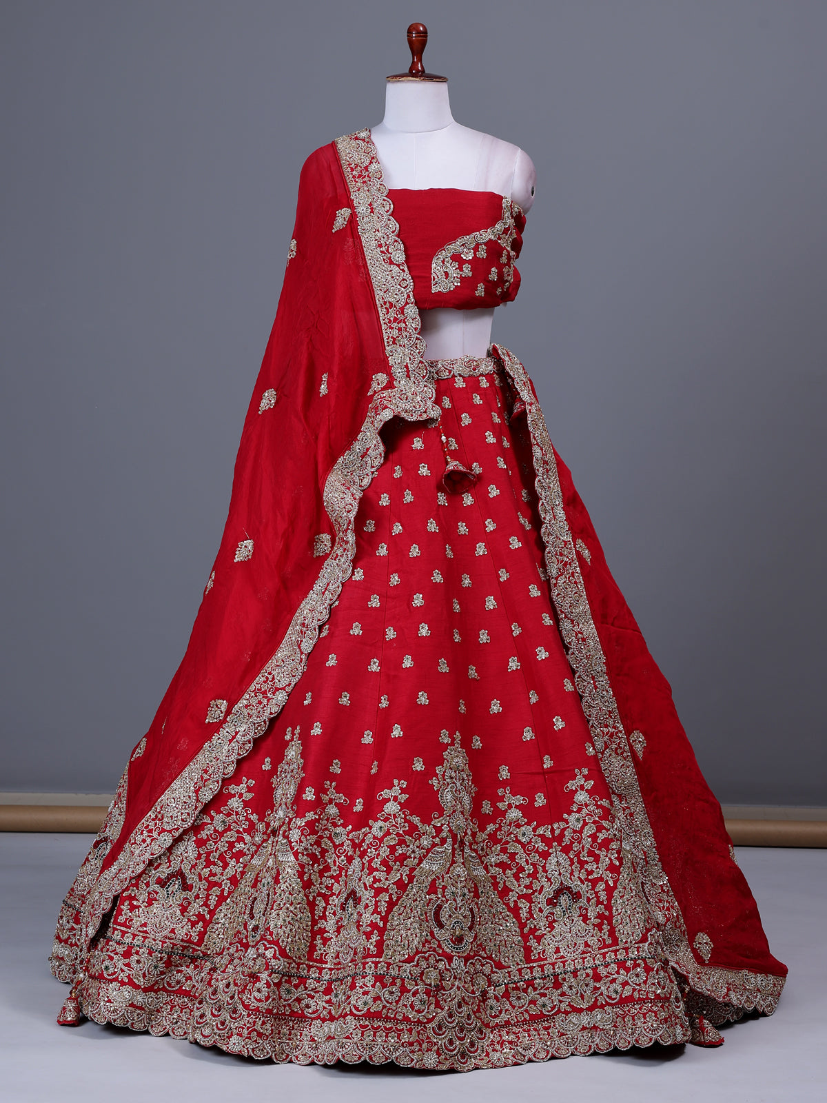 Red raw silk bridal lehenga choli with bird motifs