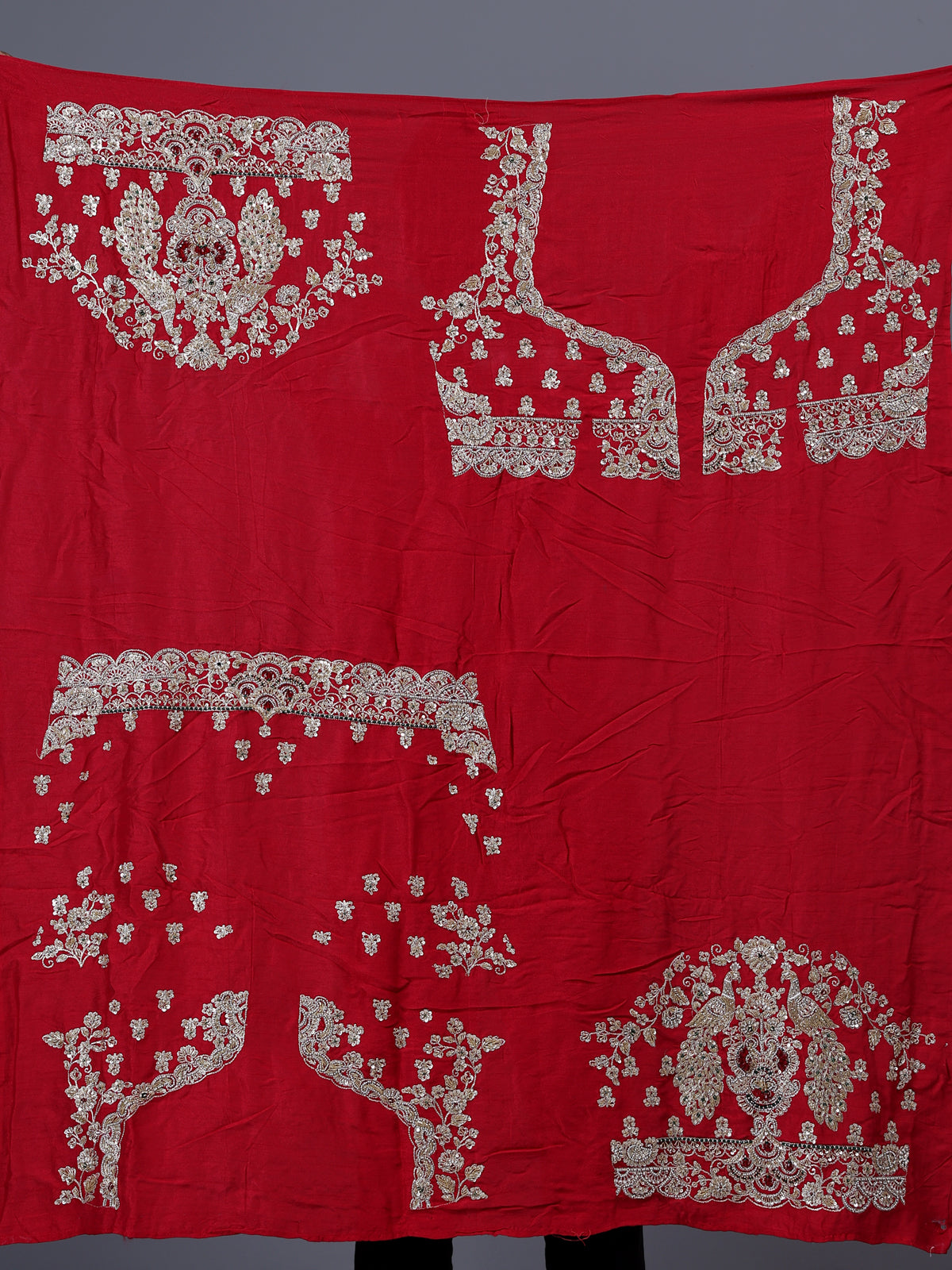 Red raw silk bridal lehenga choli with bird motifs
