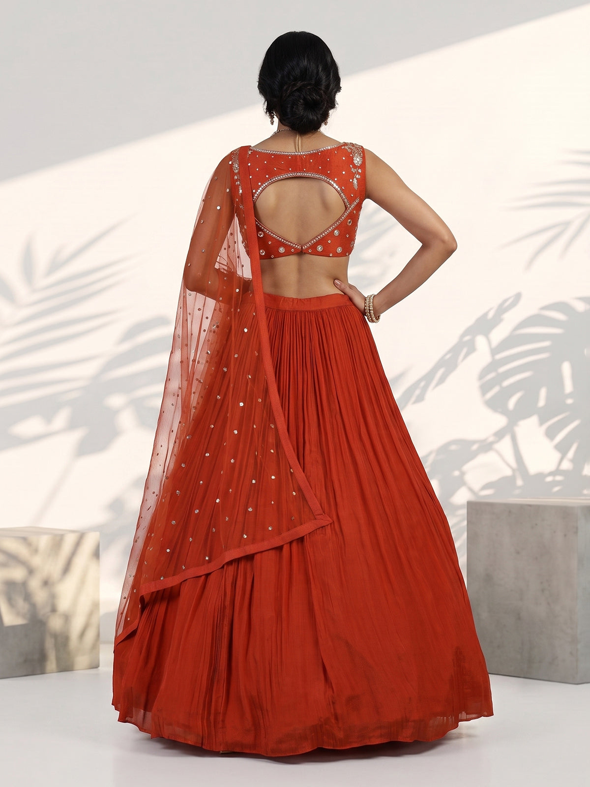 Rust orange embroidered georgette silk lehenga choli