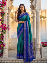 Sophisticated teal blue soft silk saree with navy pallu