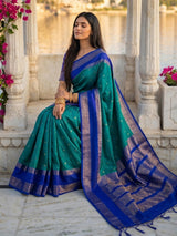 Sophisticated teal blue soft silk saree with navy pallu
