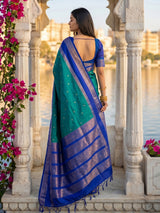 Sophisticated teal blue soft silk saree with navy pallu