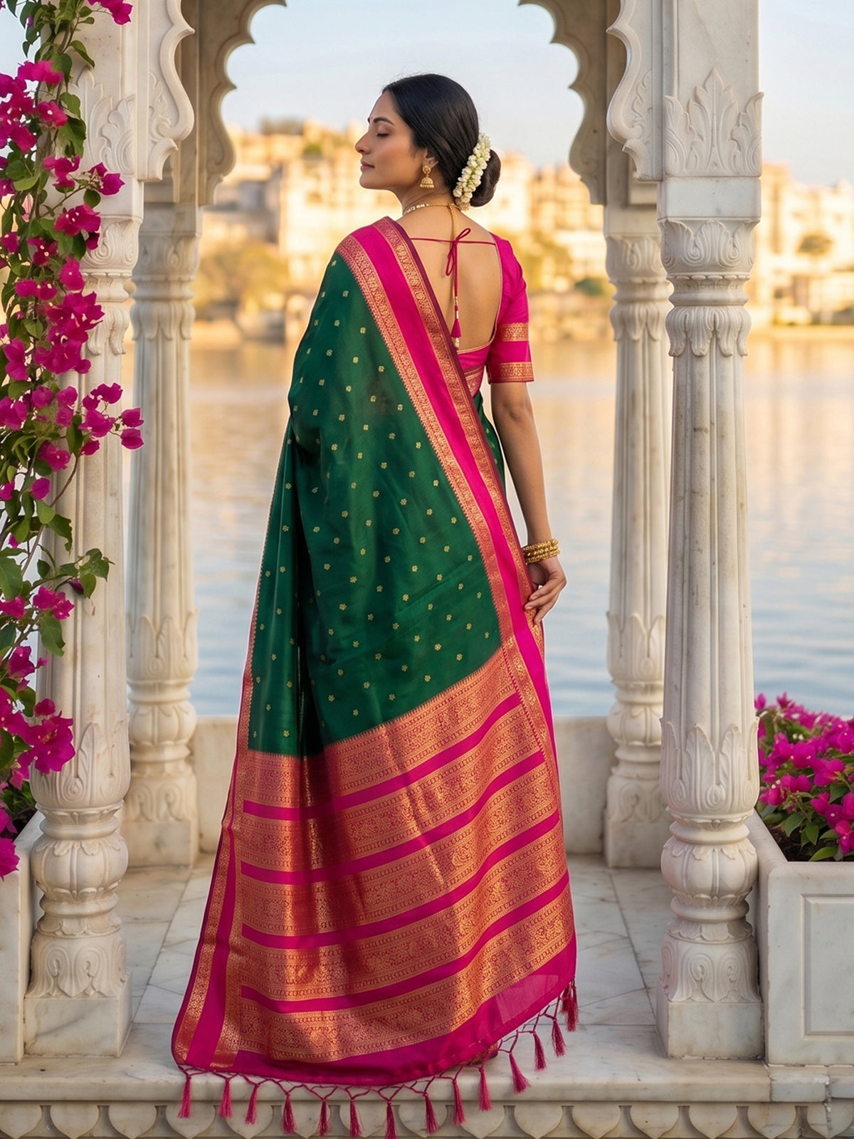 Elegant green soft silk saree with pink zari border