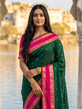 Elegant green soft silk saree with pink zari border