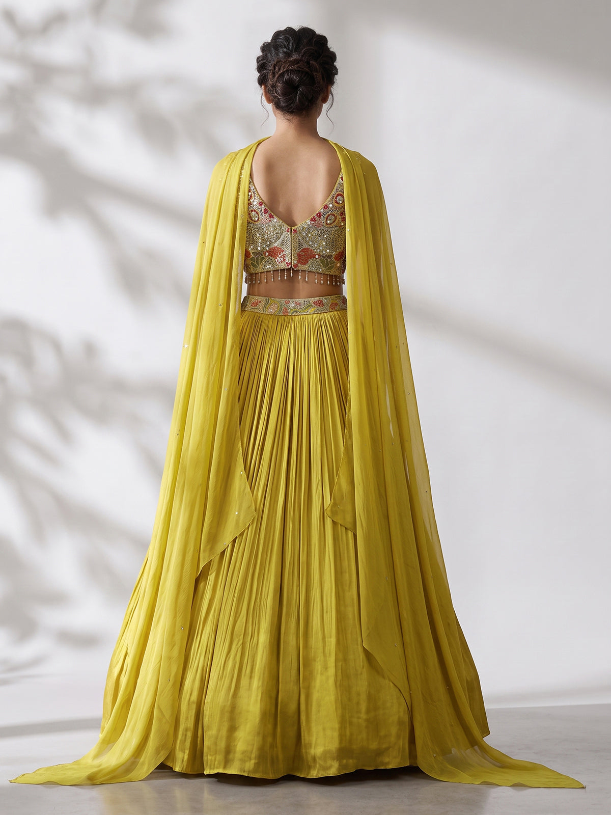 Yellow chinon silk haldi lehenga choli with choker