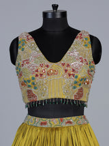 Yellow chinon silk haldi lehenga choli with choker