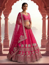 Rani pink bridal raw silk lehenga choli with embellished dupatta